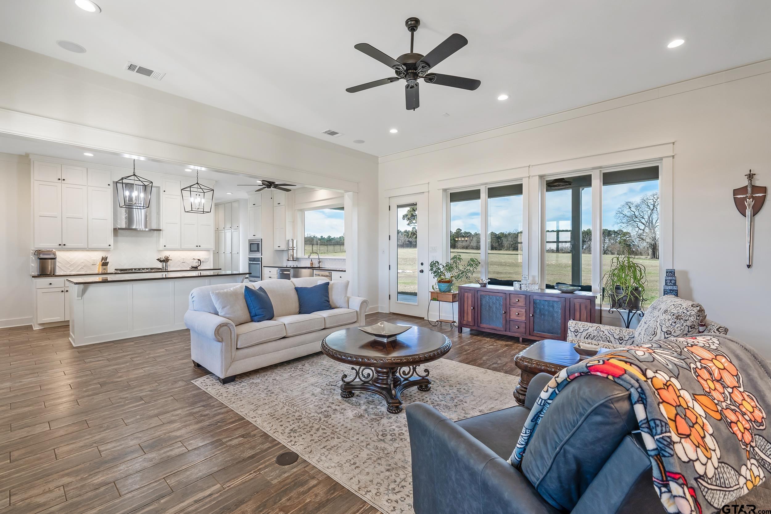 223 Riata Road Bullard, TX 75757 - Photo 8 of 45 a living room with furniture and a large window