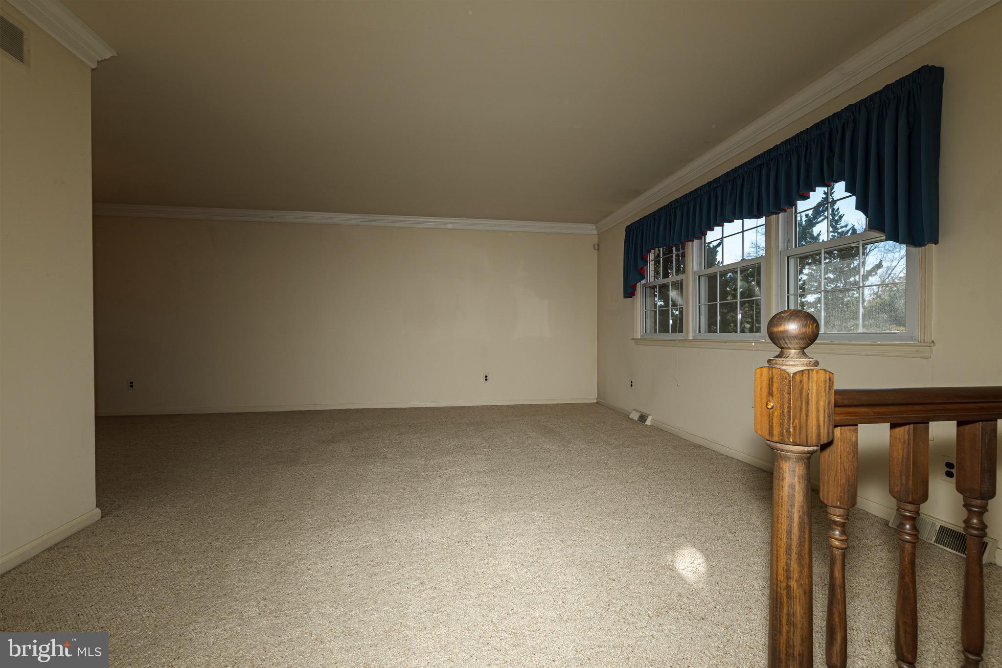 116 Autumn Horseshoe Bend Newark, DE 19702 - Photo 11 of 43 a view of a room with a floor to ceiling window and chandelier
