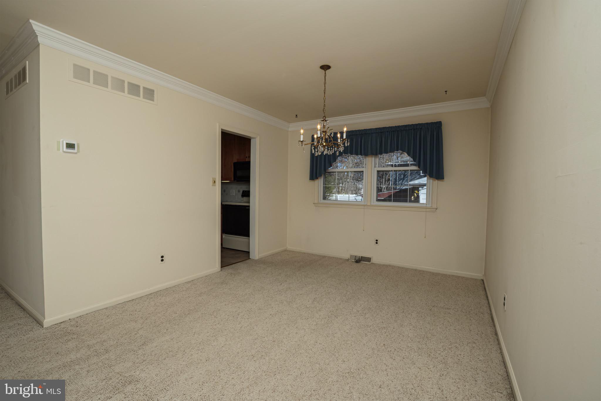 116 Autumn Horseshoe Bend Newark, DE 19702 - Photo 16 of 43 a view of a room with a chandelier fan and windows