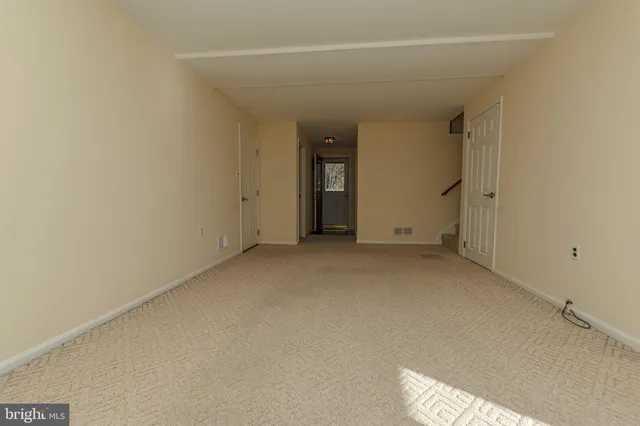 a bathroom with a toilet sink vanity and mirror