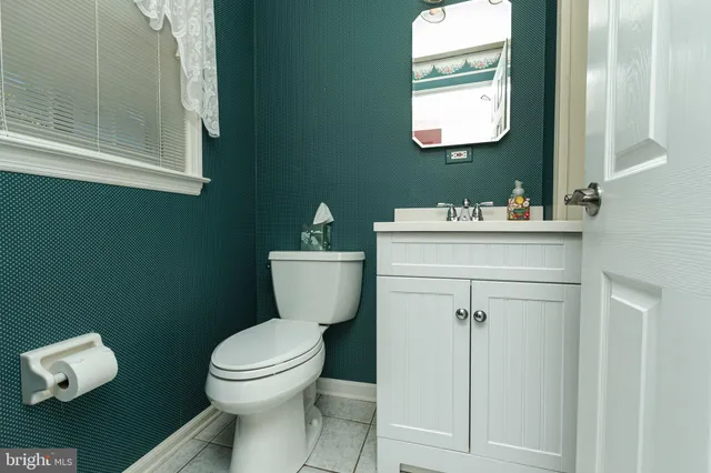 a bathroom with a shower sink and mirror