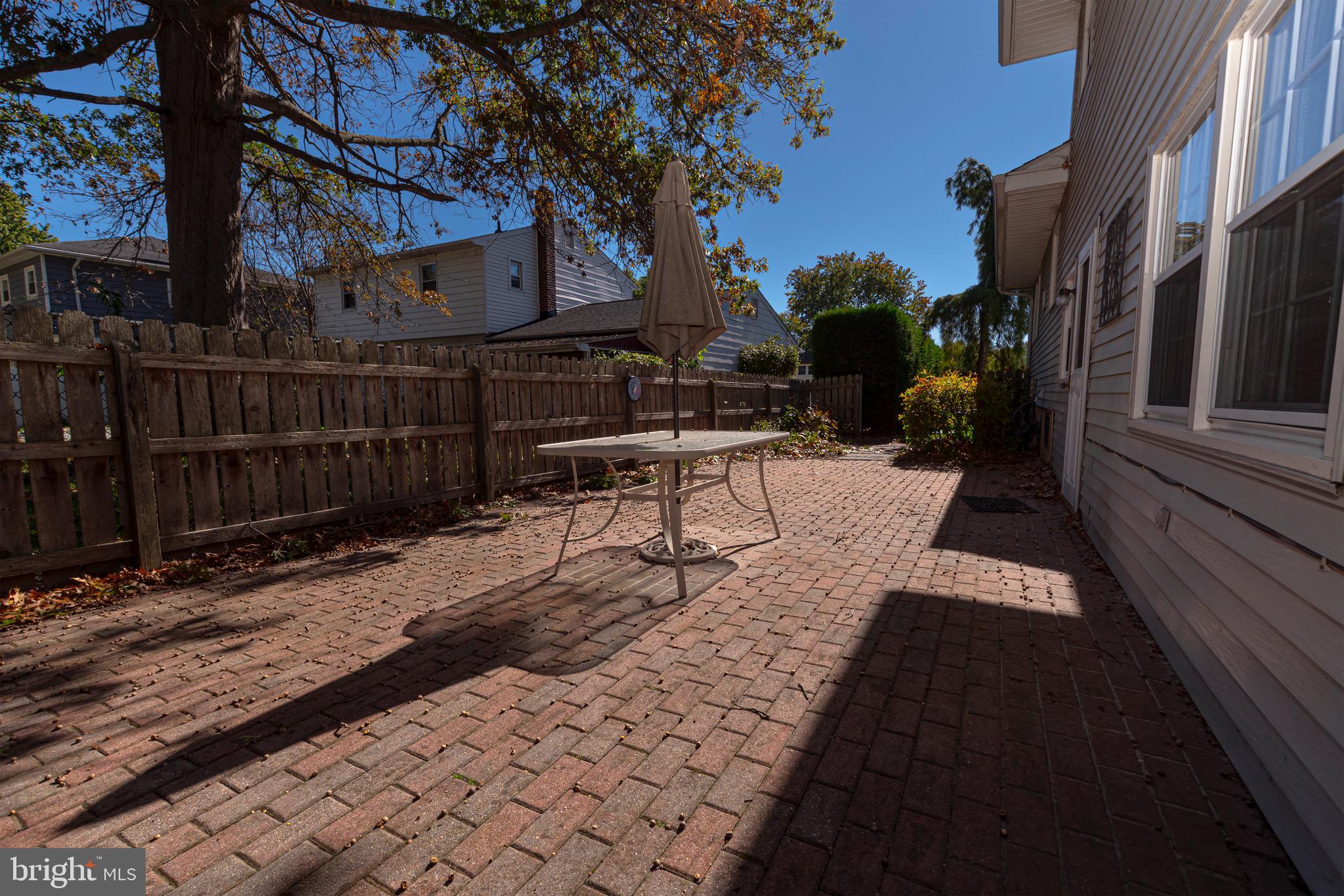 116 Autumn Horseshoe Bend Newark, DE 19702 - Photo 41 of 43 a view of a patio with a table and chairs next to a yard