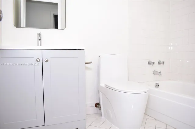 a bathroom with a bathtub and a sink