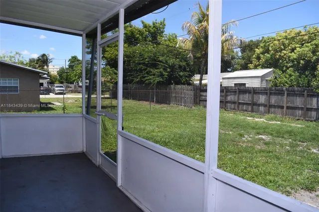 a view of a backyard with a garden and plants