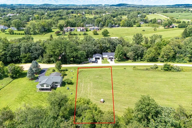 a view of a city with lush green forest