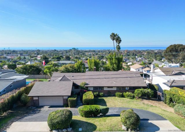 an aerial view of a house with a garden