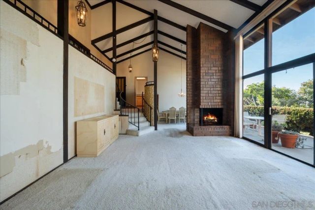 a view of a hallway with staircase