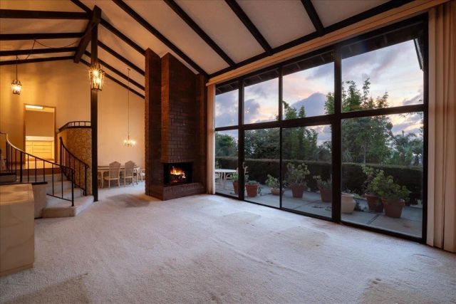 a view of an empty room with a balcony