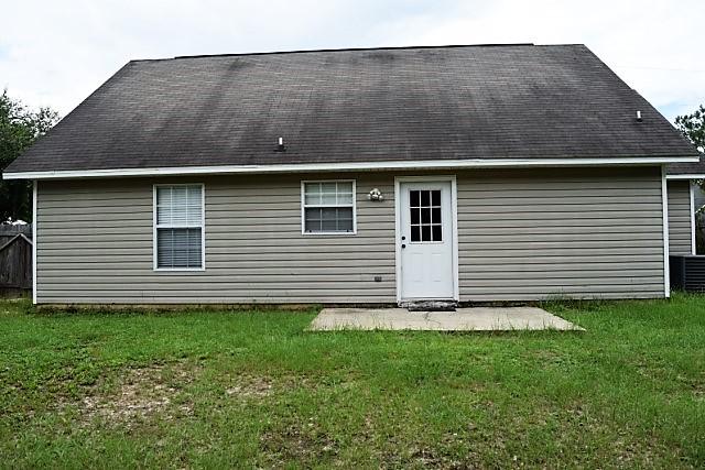 123 Oak Terrace Drive Crestview, FL 32539 - Photo 19 of 21 a backyard of a house with lots of green space