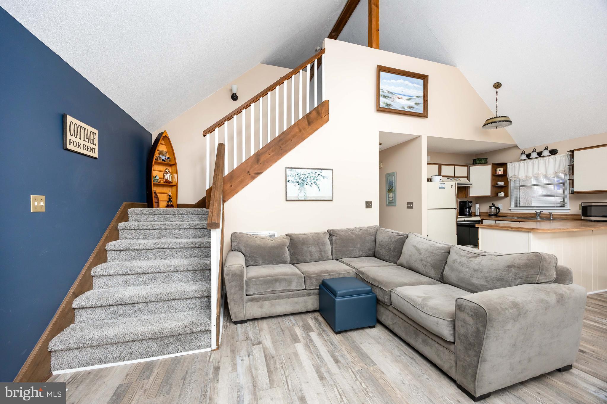 54 Falcon Bridge Road Ocean Pines, MD 21811 - Photo 13 of 53 a living room with furniture and a stair