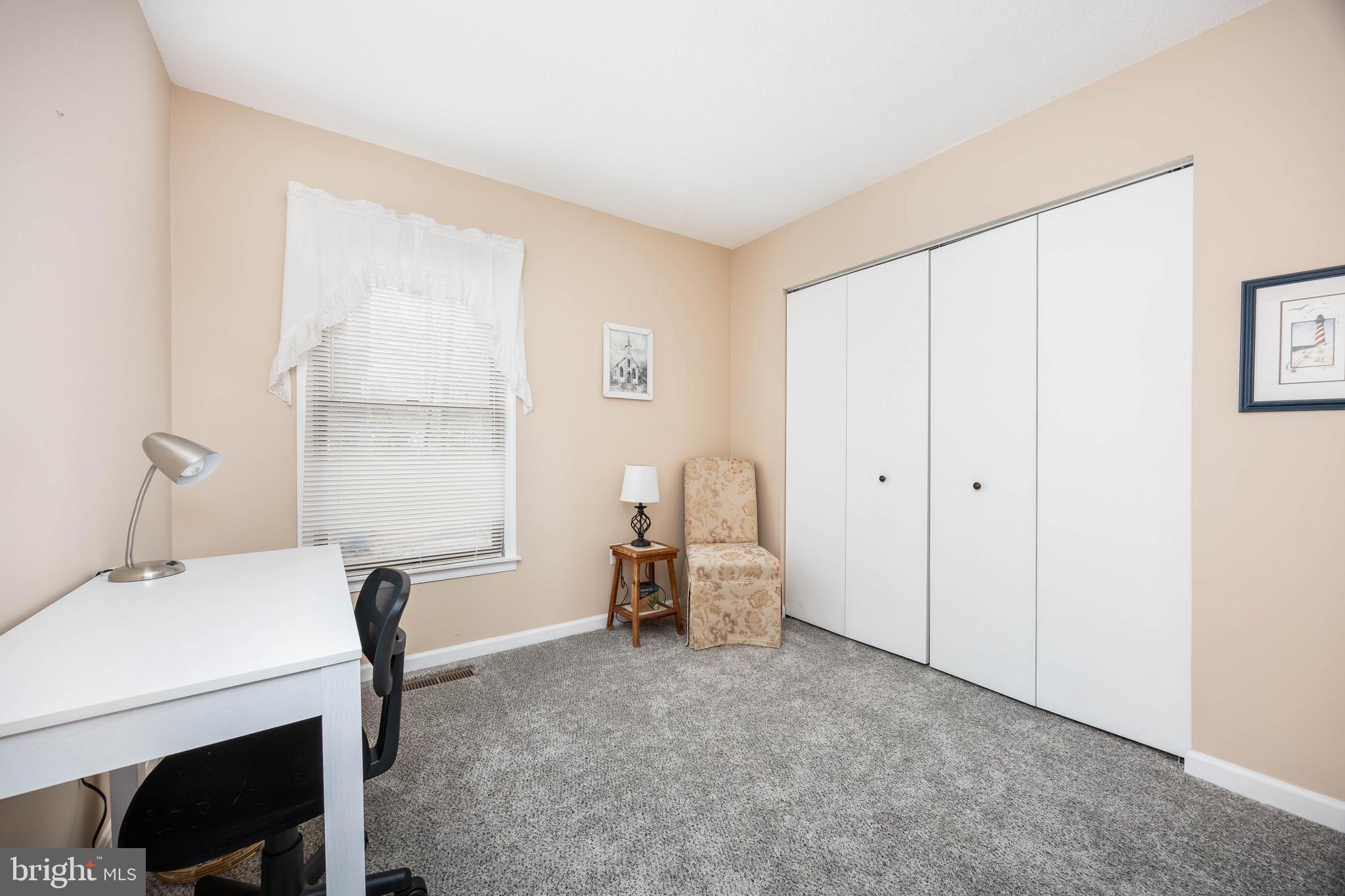 54 Falcon Bridge Road Ocean Pines, MD 21811 - Photo 21 of 53 a room with a table chair and a window