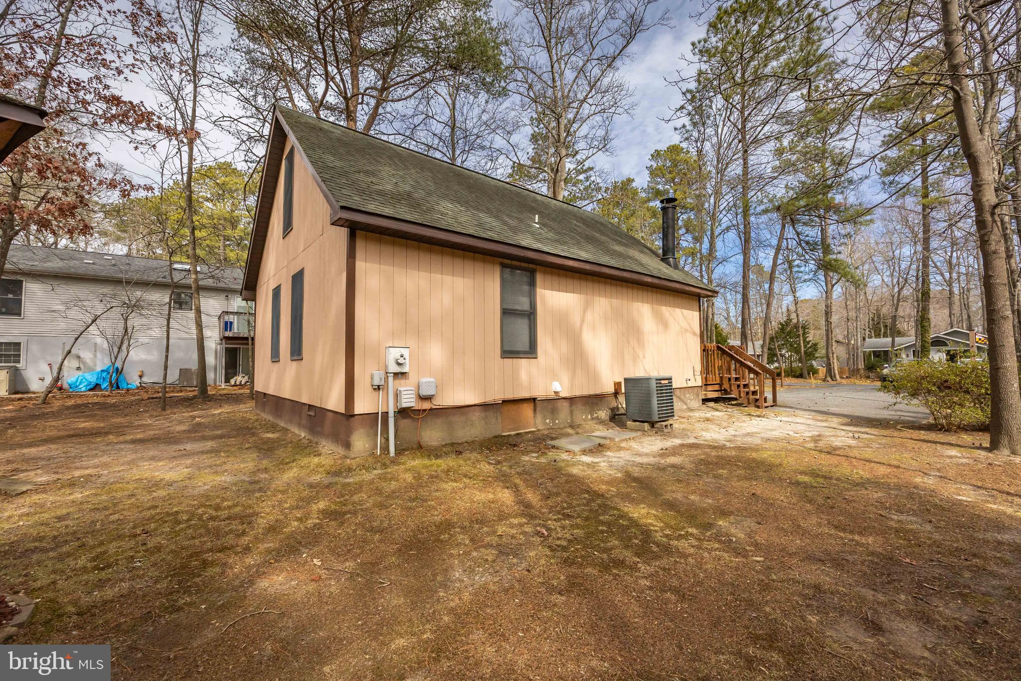 54 Falcon Bridge Road Ocean Pines, MD 21811 - Photo 48 of 53 a view of a house with a yard and garage