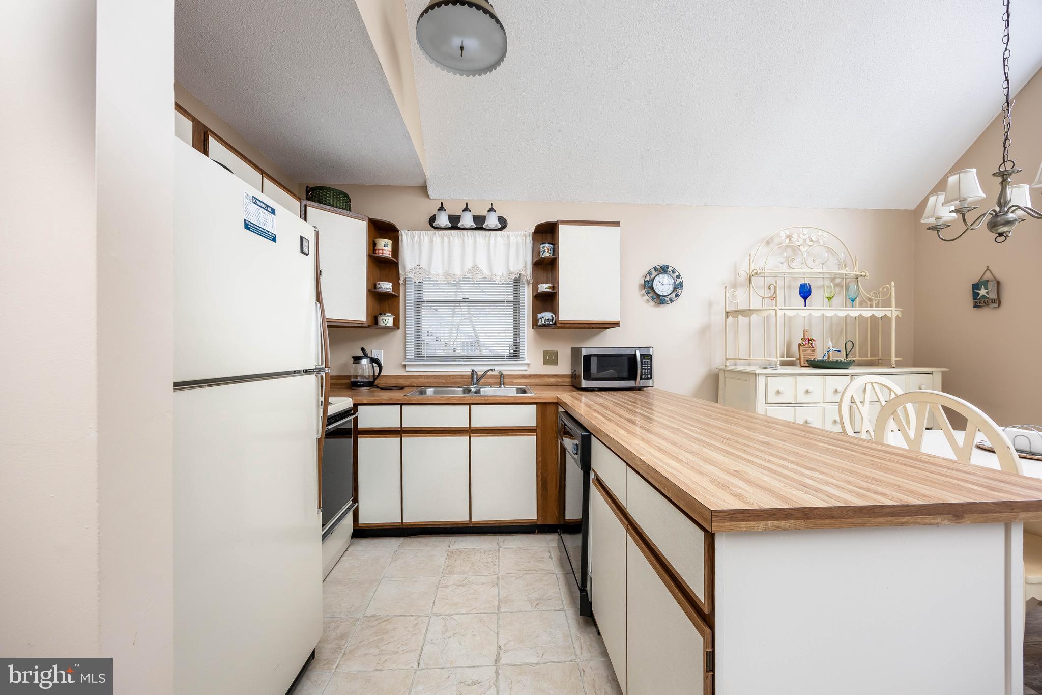 54 Falcon Bridge Road Ocean Pines, MD 21811 - Photo 8 of 53 a kitchen with stainless steel appliances granite countertop a refrigerator a stove and a sink