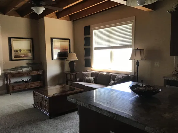 a living room with furniture and a window