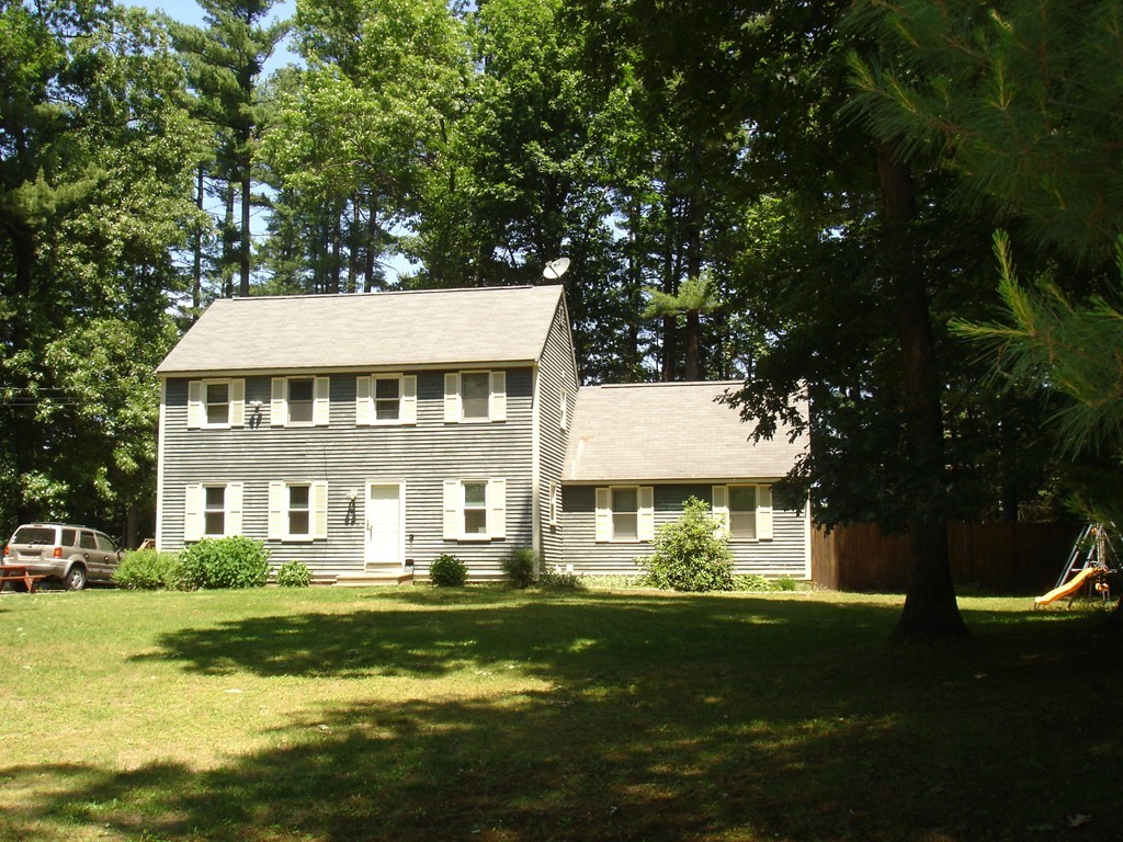 84 Groton School Road Ayer, MA 01432 - Photo 1 of 14 a view of a house with a swimming pool