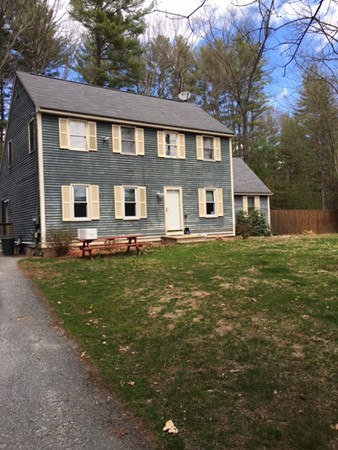 84 Groton School Road Ayer, MA 01432 - Photo 13 of 14 a front view of a house with a yard