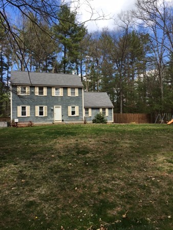 84 Groton School Road Ayer, MA 01432 - Photo 2 of 14 a front view of a house with a yard