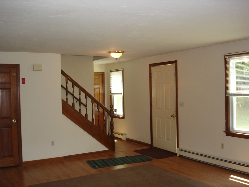 84 Groton School Road Ayer, MA 01432 - Photo 5 of 14 a view of a hallway with windows
