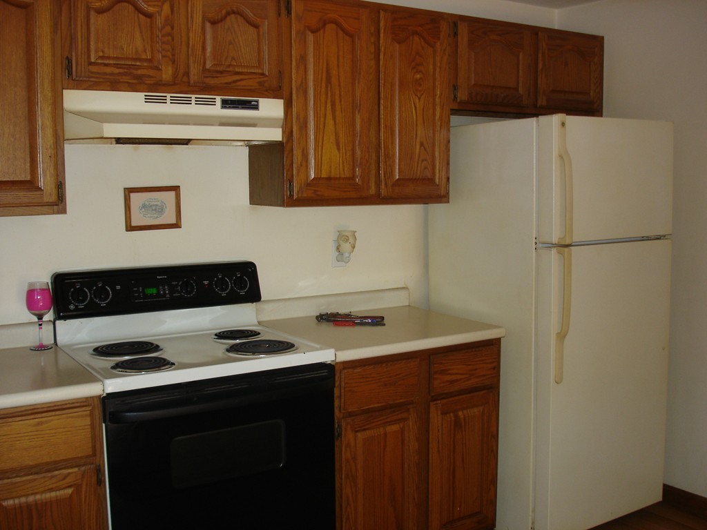 84 Groton School Road Ayer, MA 01432 - Photo 6 of 14 a kitchen with stainless steel appliances a refrigerator and a stove top oven