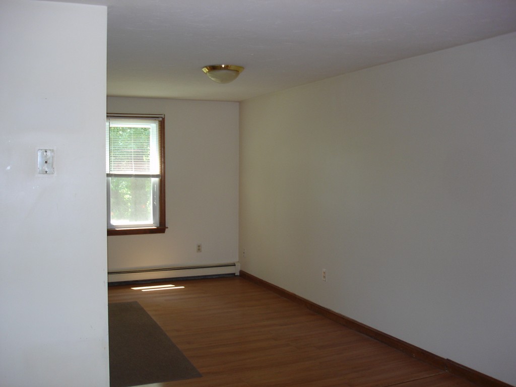 84 Groton School Road Ayer, MA 01432 - Photo 7 of 14 an empty room with a window