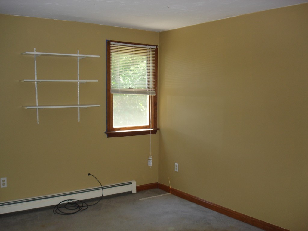 84 Groton School Road Ayer, MA 01432 - Photo 8 of 14 an empty room with a window
