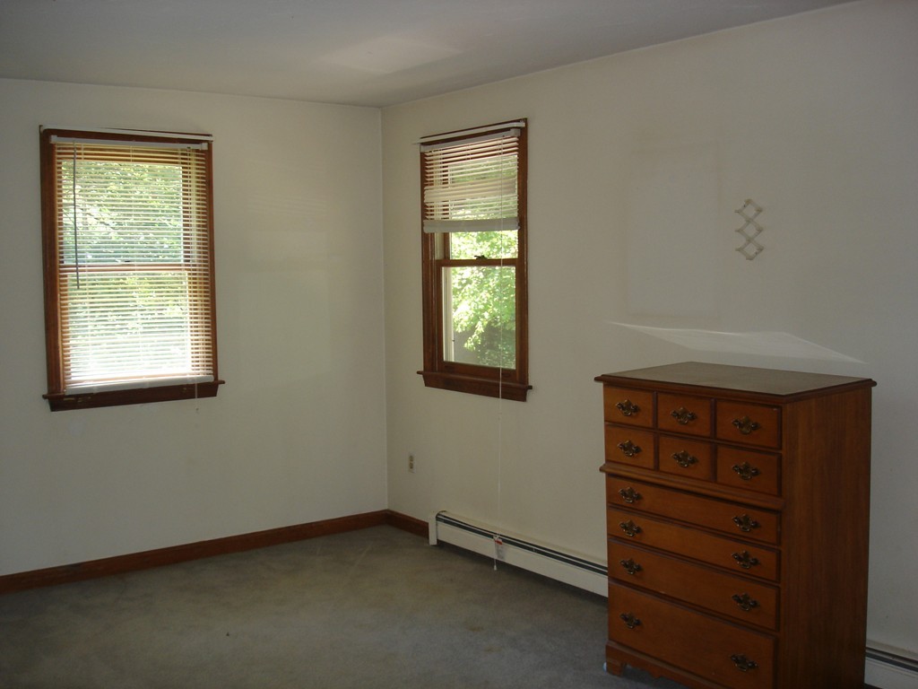 84 Groton School Road Ayer, MA 01432 - Photo 9 of 14 a view of an empty room with a window