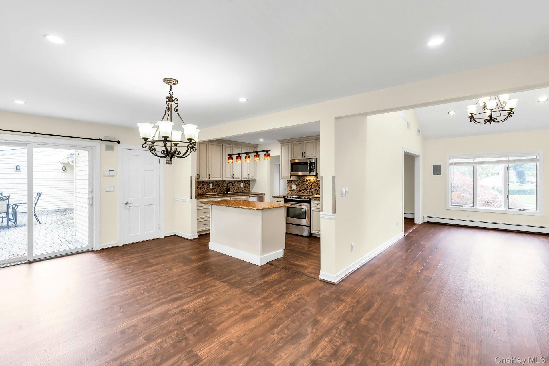 4 Greenway Drive Syosset, NY 11791 - Photo 28 of 29 a view of a room with wooden floor and kitchen