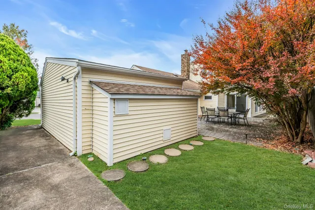a view of a house with a backyard