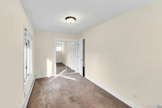 a view of a livingroom with wooden floor and a sink
