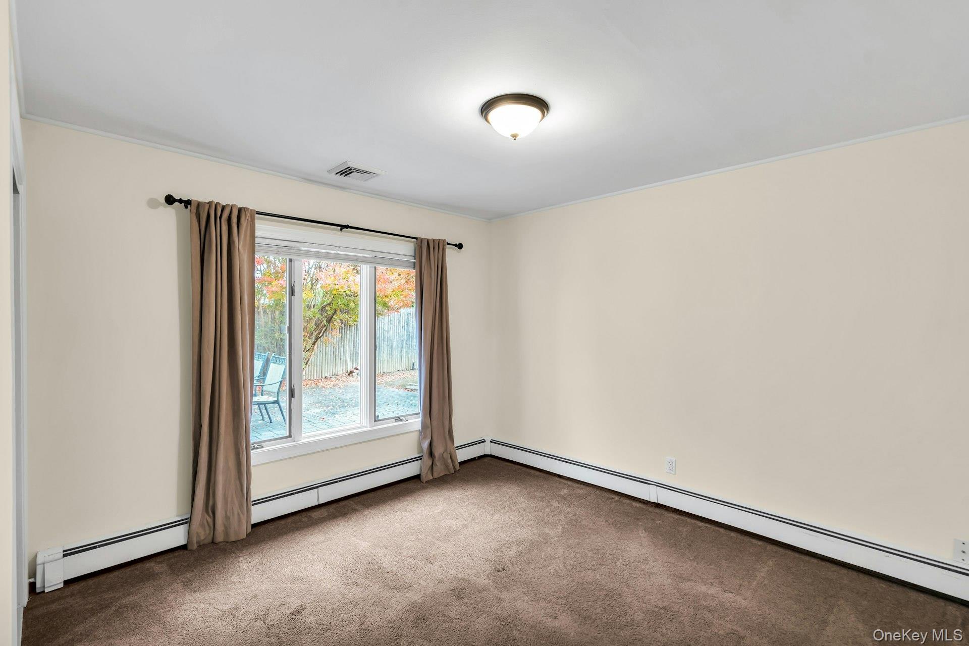 4 Greenway Drive Syosset, NY 11791 - Photo 20 of 29 a view of an empty room with a window