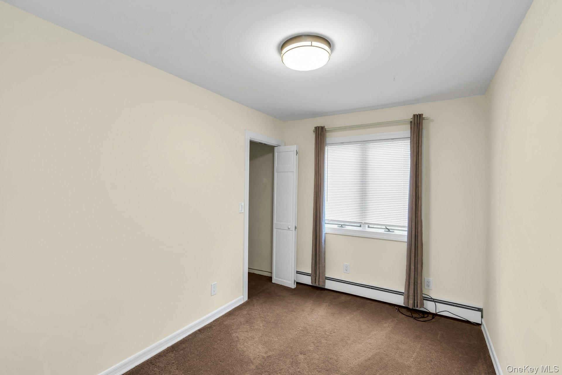 4 Greenway Drive Syosset, NY 11791 - Photo 22 of 29 an empty room with a door