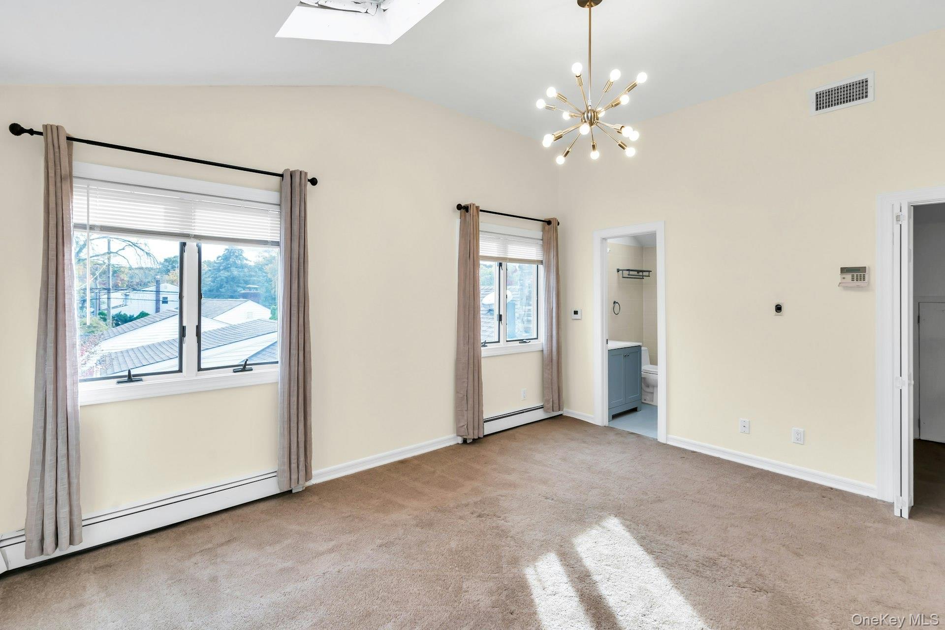 4 Greenway Drive Syosset, NY 11791 - Photo 25 of 29 a view of a livingroom with a chandelier fan and windows