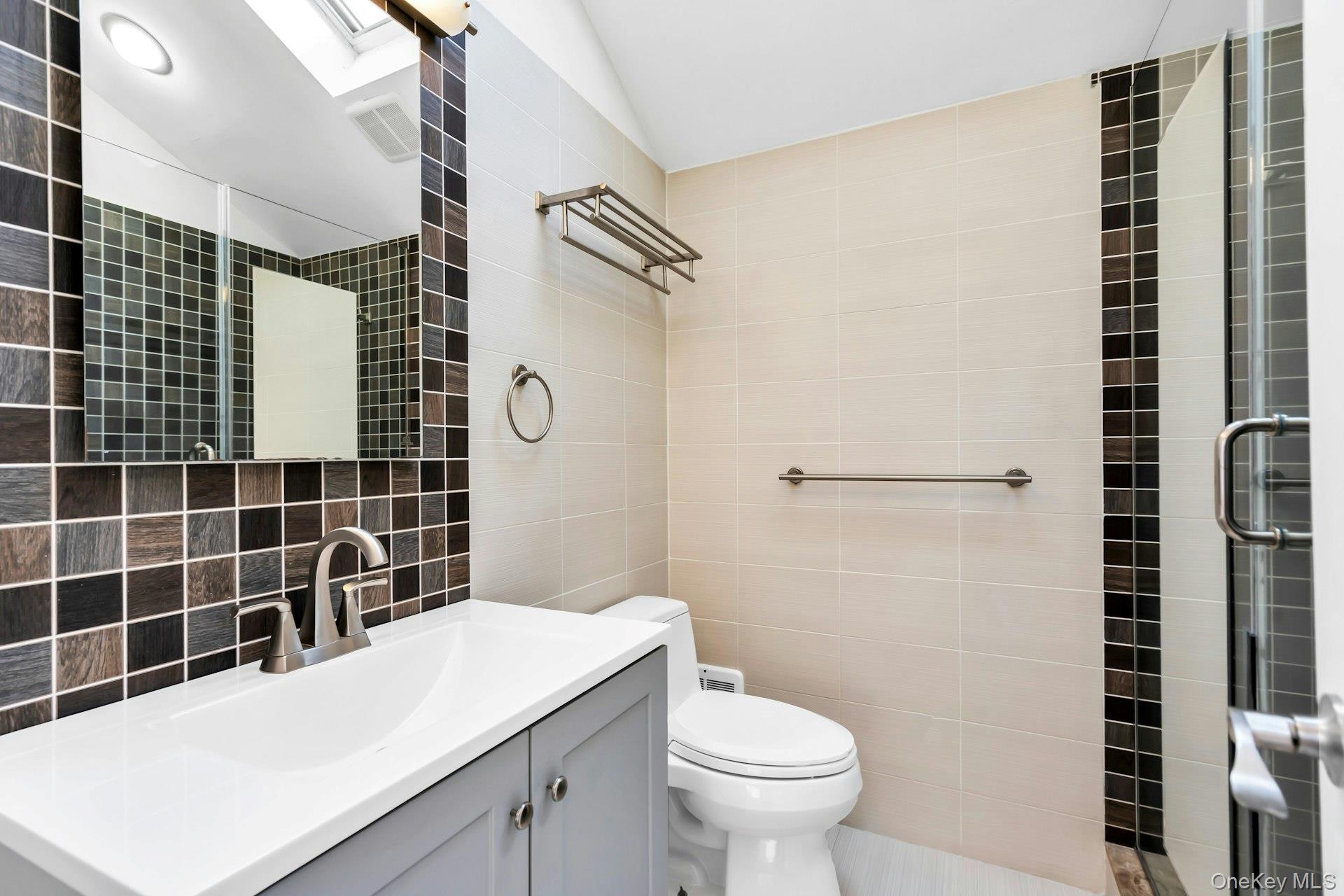 4 Greenway Drive Syosset, NY 11791 - Photo 26 of 29 a bathroom with a sink toilet and shower