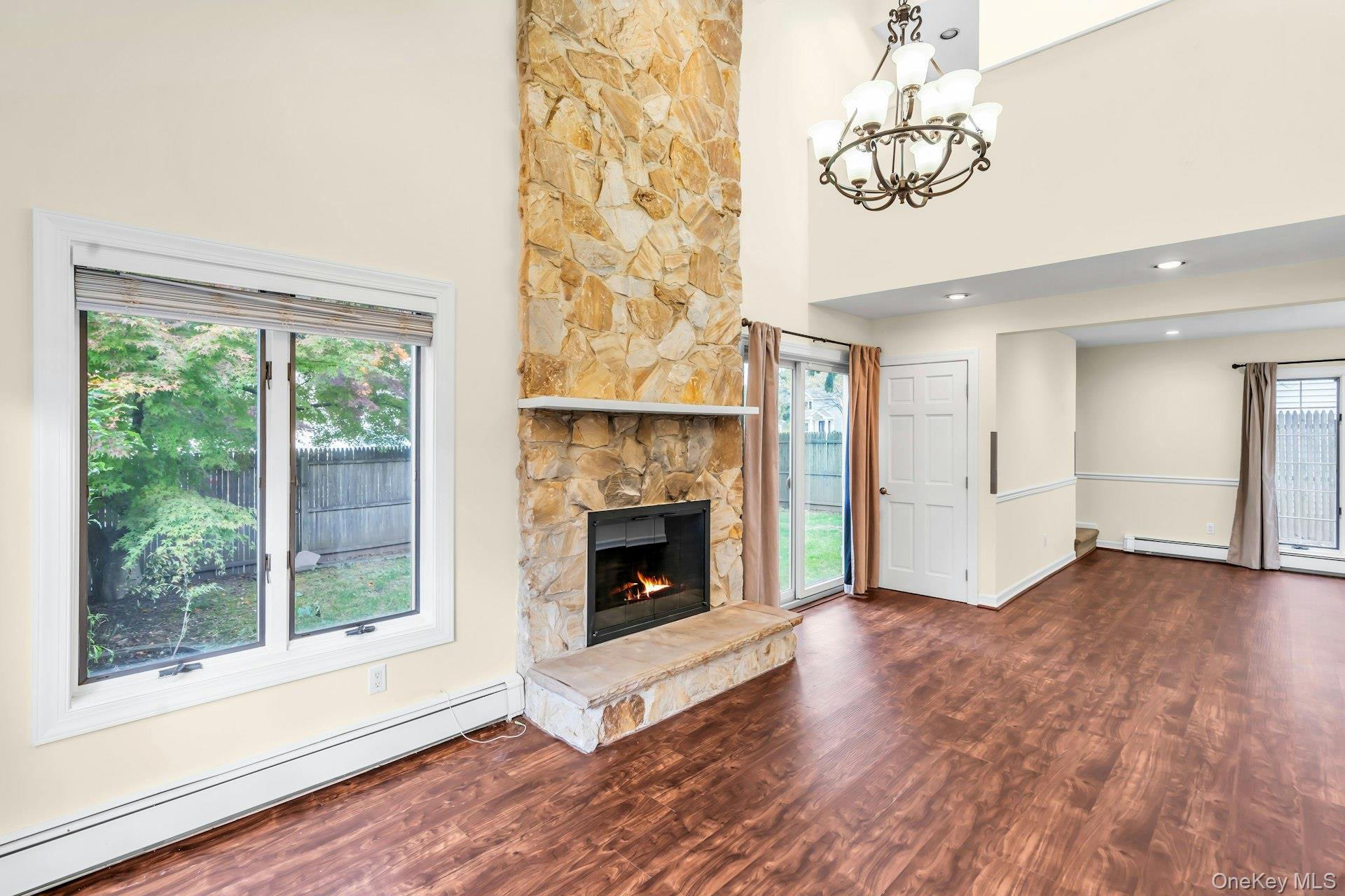 4 Greenway Drive Syosset, NY 11791 - Photo 8 of 29 a view of a livingroom with a fireplace and window