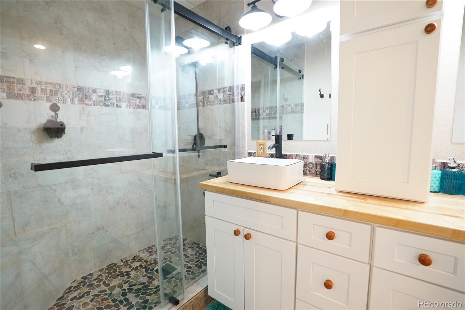 336 County Road 64 Shawnee, CO 80475 - Photo 15 of 40 a bathroom with a sink and mirror