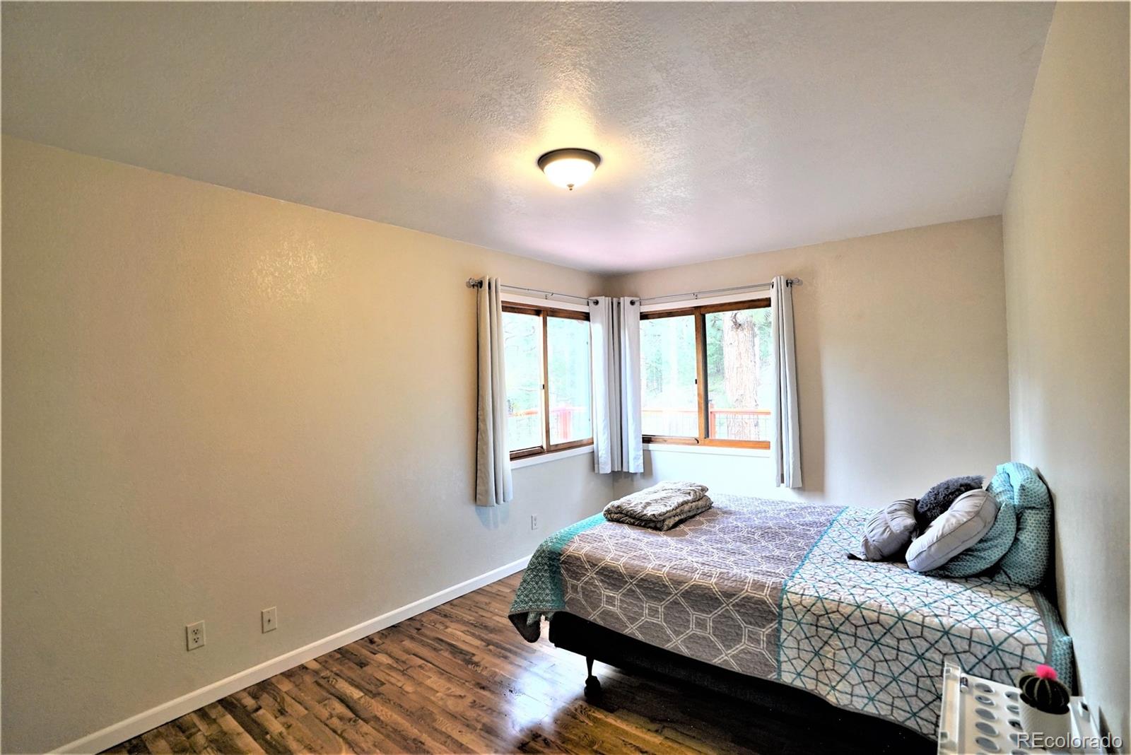 336 County Road 64 Shawnee, CO 80475 - Photo 20 of 40 a bedroom with a bed and a window