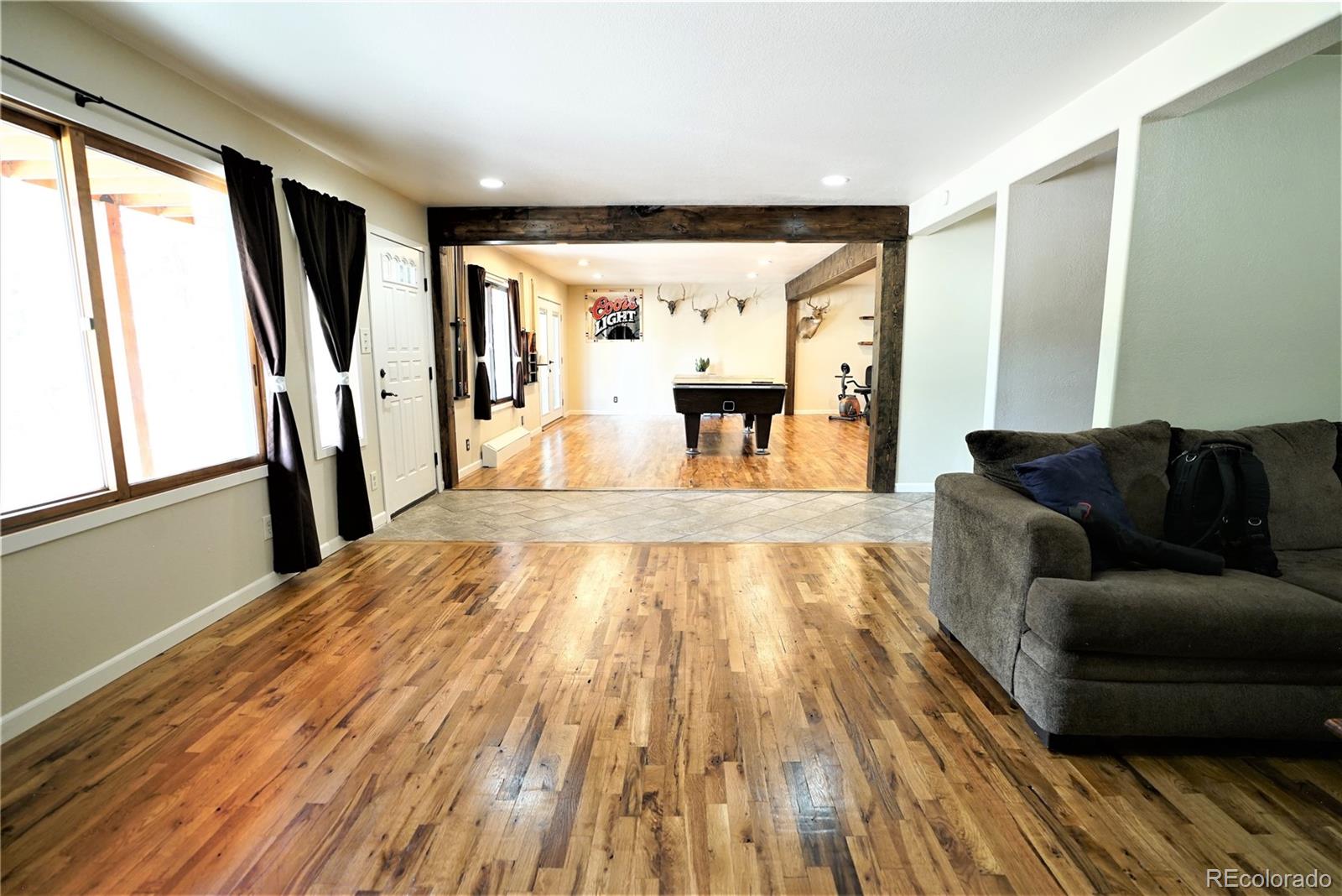 336 County Road 64 Shawnee, CO 80475 - Photo 26 of 40 a living room with stainless steel appliances furniture wooden floor and a large window