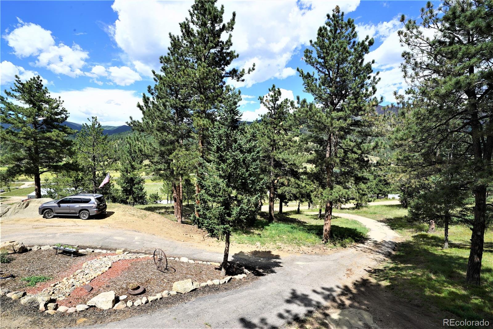 336 County Road 64 Shawnee, CO 80475 - Photo 35 of 40 a view of backyard with table and chairs and a fire pit