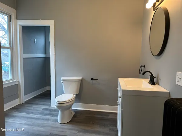 a bathroom with a toilet and a sink