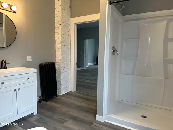 a bathroom with a sink and a mirror