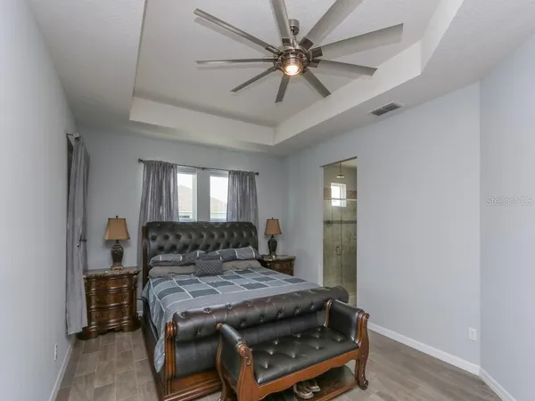 a bathroom with a double vanity sink mirror and shower