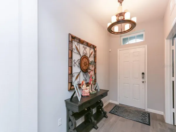 a kitchen with a table and chairs in it