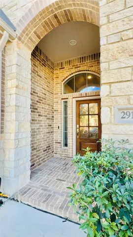 a front view of a house with a large window