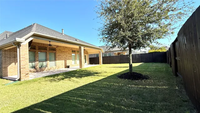 a view of a lake with houses in the back
