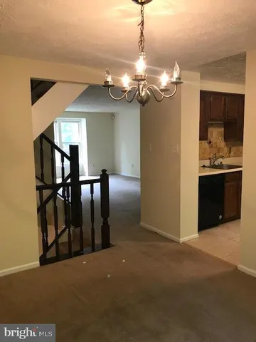 a view of a livingroom with a kitchen