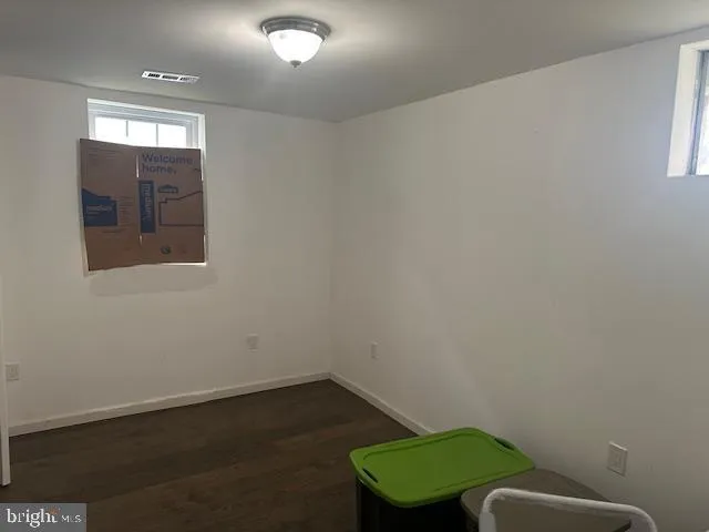 an empty room with windows