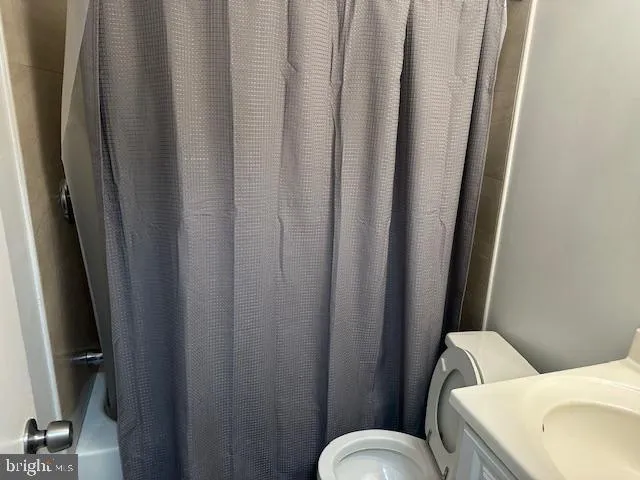 a bathroom with a sink and toilet