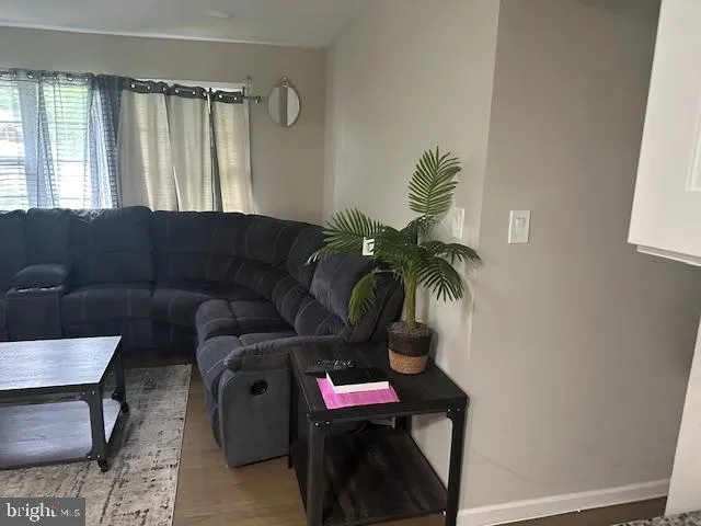 a bedroom with a bed and a potted plant