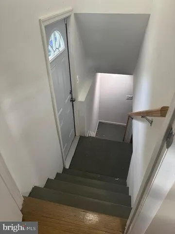 a view of staircase with wooden floor
