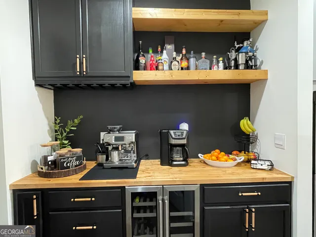 a kitchen with a sink a stove and cabinets